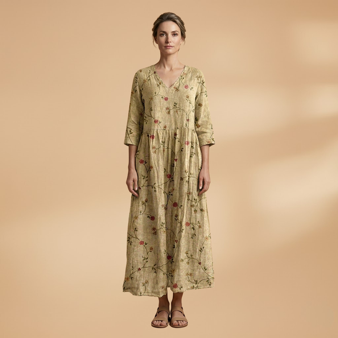 Flora Women’s Dress featuring a V-neck design and a flowing skirt adorned with a vibrant floral pattern, perfect for summer outings and special occasions. 6