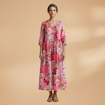 Flora Women’s Dress featuring a V-neck design and a flowing skirt adorned with a vibrant floral pattern, perfect for summer outings and special occasions. 7