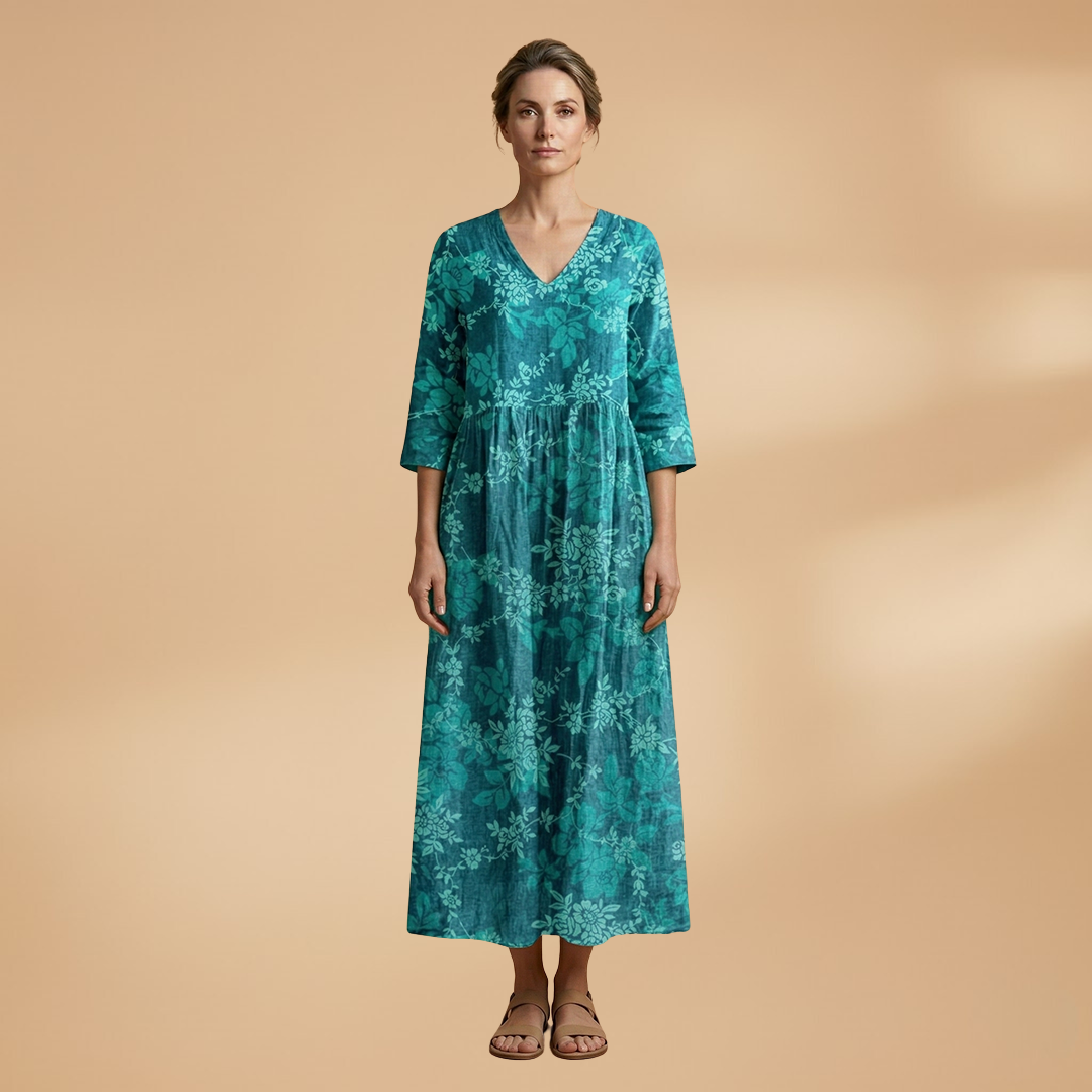 Flora Women’s Dress featuring a V-neck design and a flowing skirt adorned with a vibrant floral pattern, perfect for summer outings and special occasions. 8