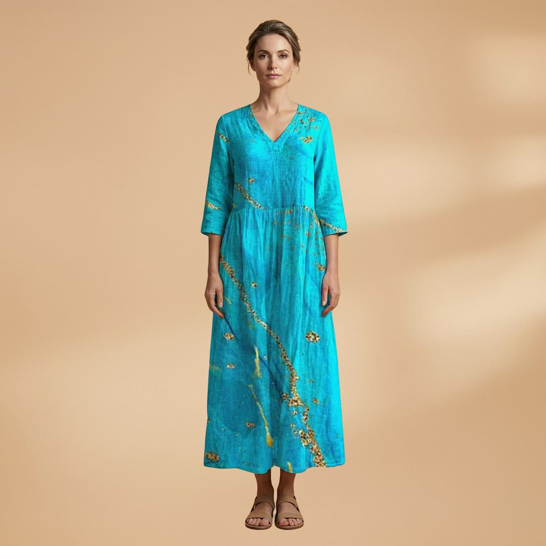Flora Women’s Dress featuring a V-neck design and a flowing skirt adorned with a vibrant floral pattern, perfect for summer outings and special occasions. 9
