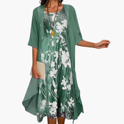 Flora Women’s Maxi Dress featuring a vibrant floral pattern paired with a stylish layered cardigan, perfect for spring and summer outings. 3