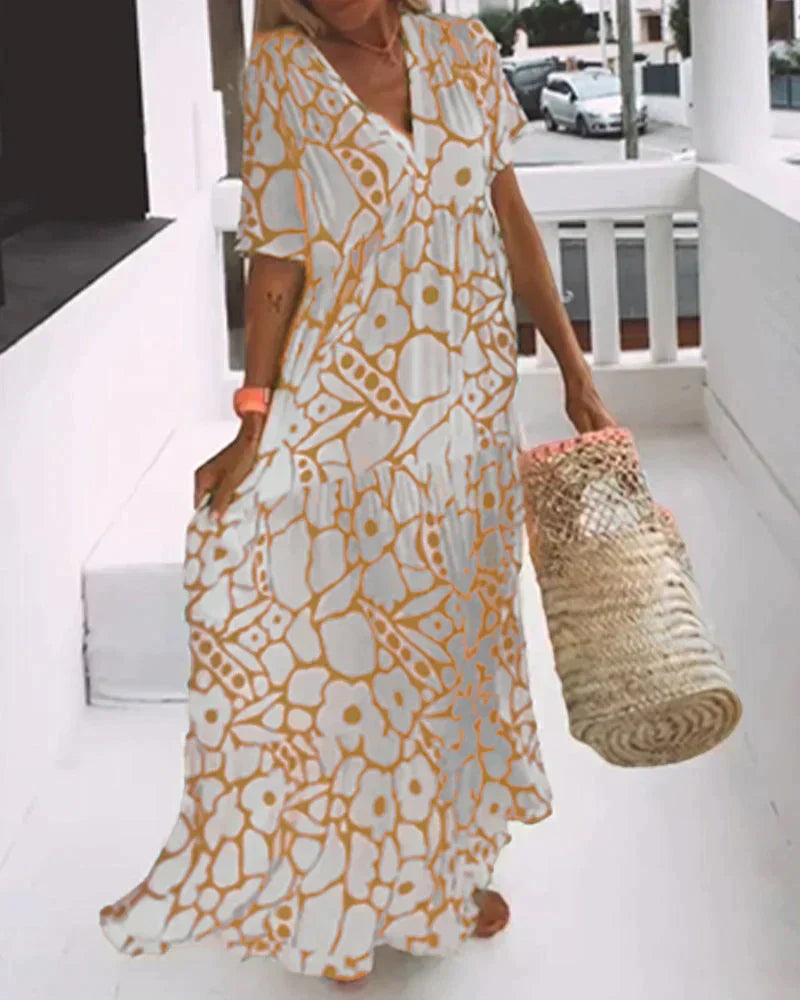 Flora Women’s Maxi Dress featuring a stylish V-Neck and elegant flutter sleeves, designed in a vibrant abstract print perfect for summer outings. 1