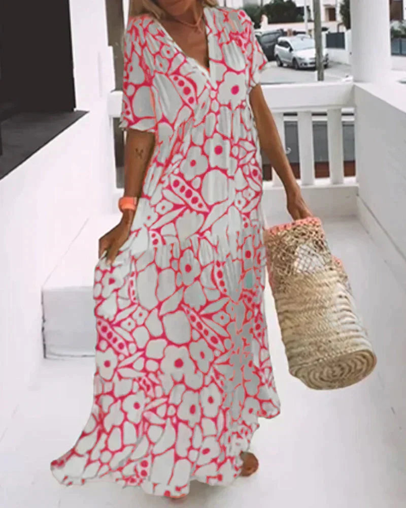 Flora Women’s Maxi Dress featuring a stylish V-Neck and elegant flutter sleeves, designed in a vibrant abstract print perfect for summer outings. 2