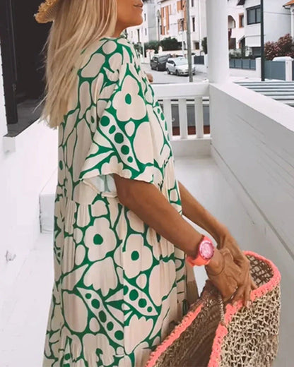 Flora Women’s Maxi Dress featuring a stylish V-Neck and elegant flutter sleeves, designed in a vibrant abstract print perfect for summer outings. 4