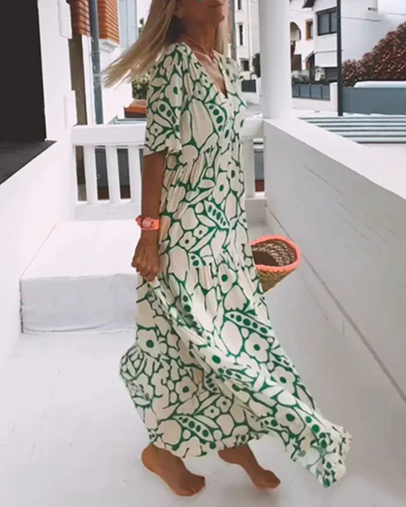 Flora Women’s Maxi Dress featuring a stylish V-Neck and elegant flutter sleeves, designed in a vibrant abstract print perfect for summer outings. 5