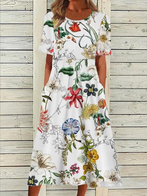 Flora Women’s Midi Dress featuring a vibrant floral print, elegantly designed with functional side pockets for practicality and style. 1