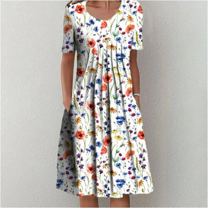 Flora Women’s Summer Dress featuring a vibrant floral print, short sleeves, and convenient side pockets, perfect for warm weather outings. 0