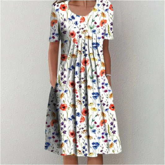 Flora Women’s Summer Dress featuring a vibrant floral print, short sleeves, and convenient side pockets, perfect for warm weather outings. 0