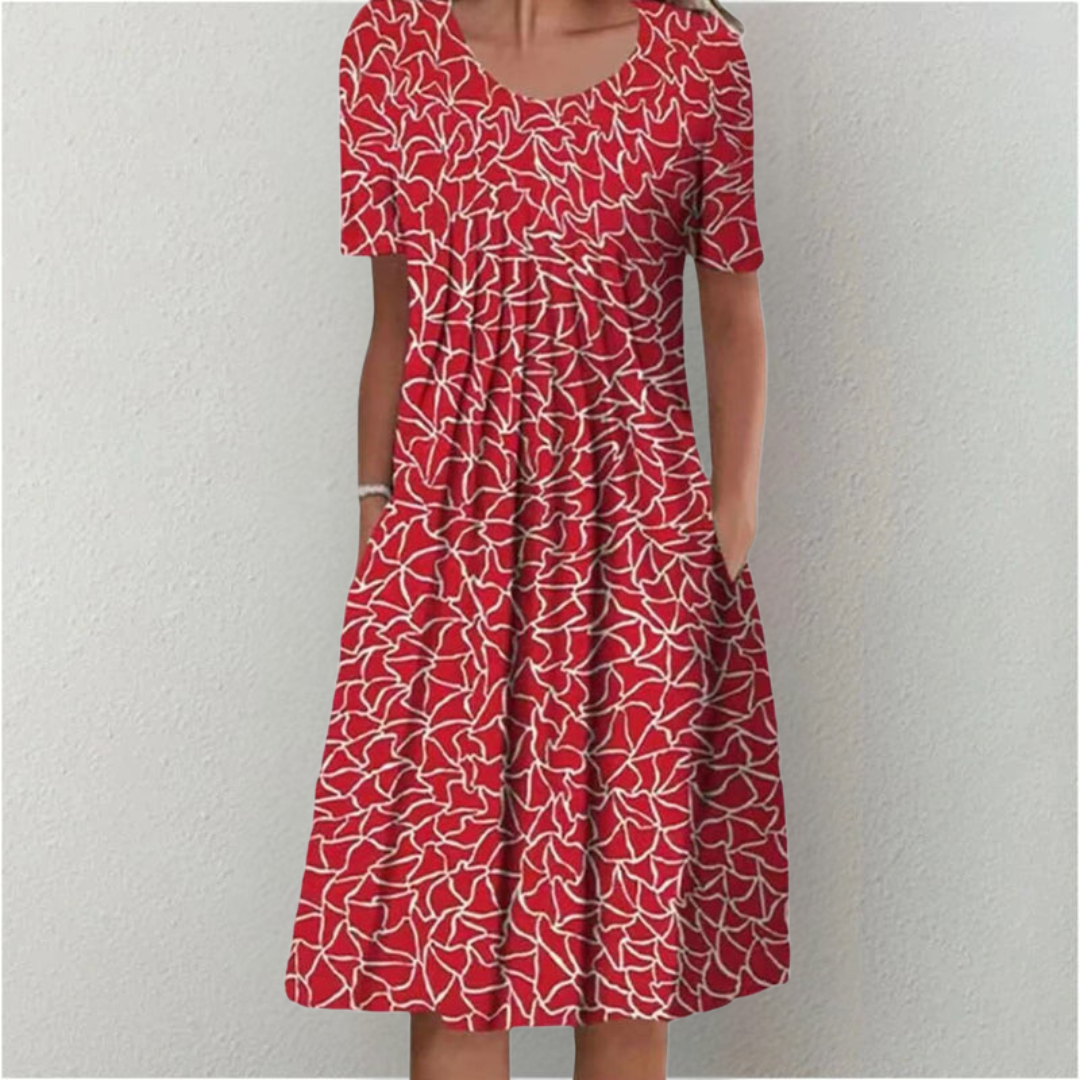 Flora Women’s Summer Dress featuring a vibrant floral print, short sleeves, and convenient side pockets, perfect for warm weather outings. 5