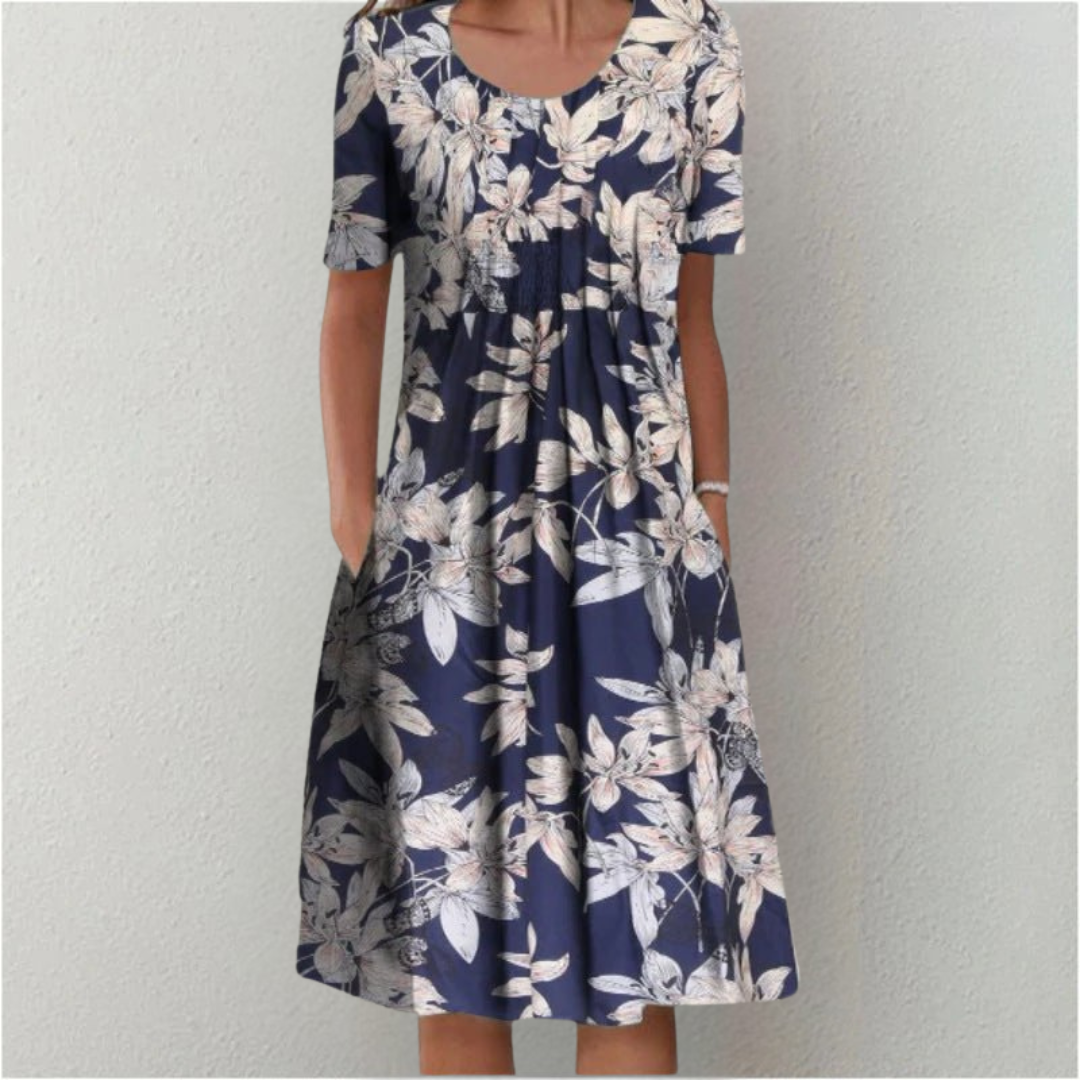 Flora Women’s Summer Dress featuring a vibrant floral print, short sleeves, and convenient side pockets, perfect for warm weather outings. 6