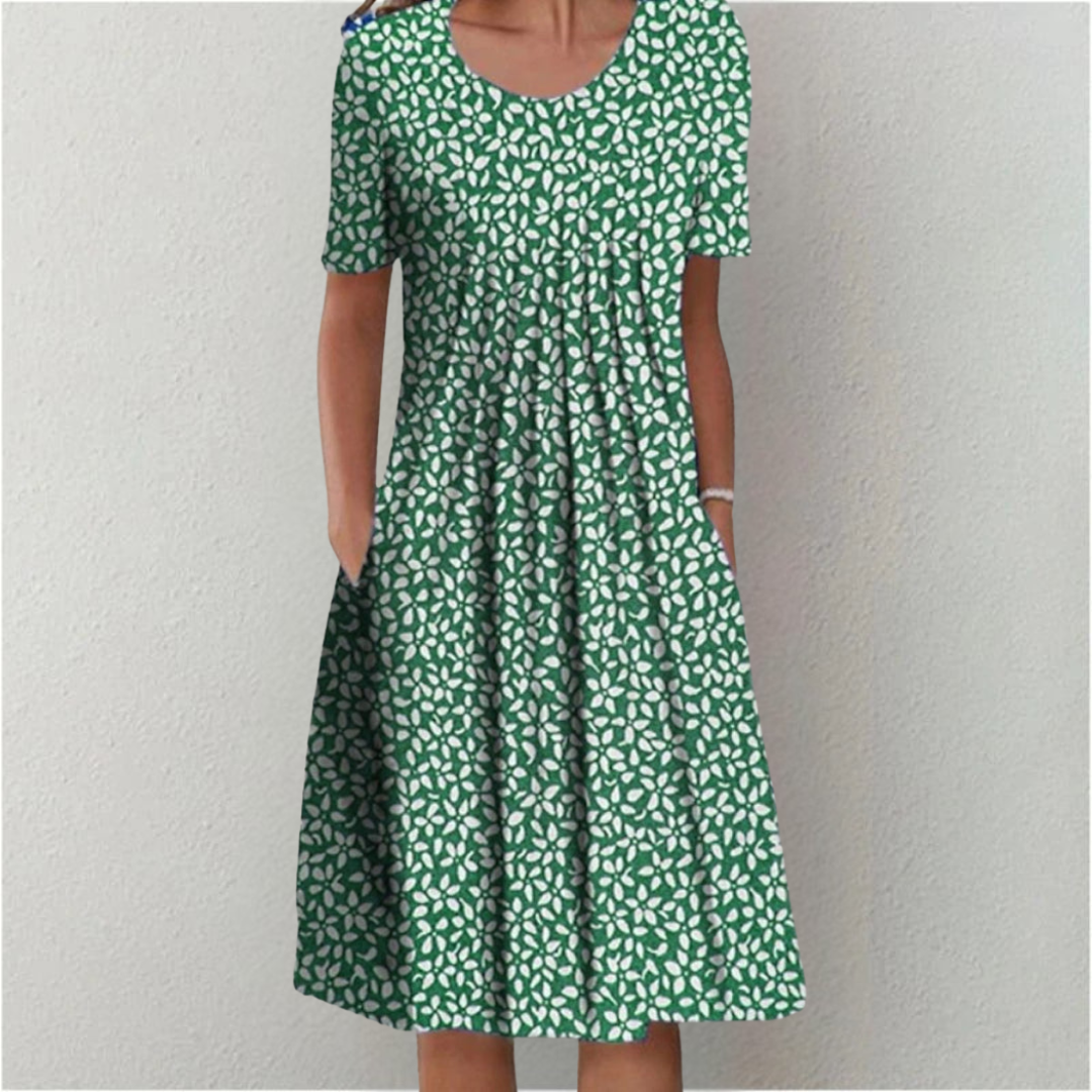 Flora Women’s Summer Dress featuring a vibrant floral print, short sleeves, and convenient side pockets, perfect for warm weather outings. 8