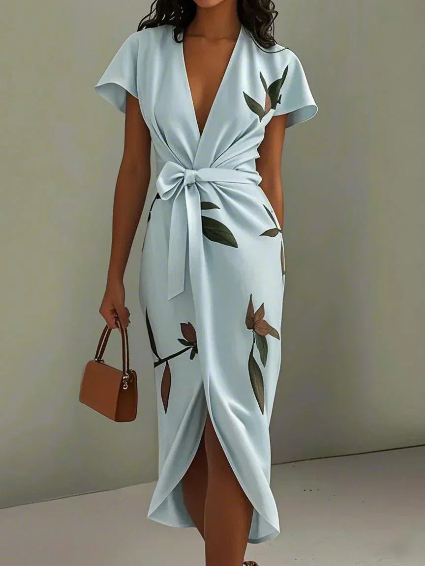 Gala Women’s Wrap Dress featuring an adjustable tie and a stylish leaf print design, perfect for versatile summer outings. 1