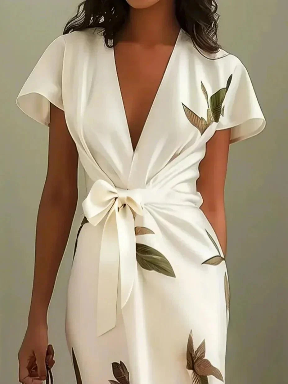 Gala Women’s Wrap Dress featuring an adjustable tie and a stylish leaf print design, perfect for versatile summer outings. 3