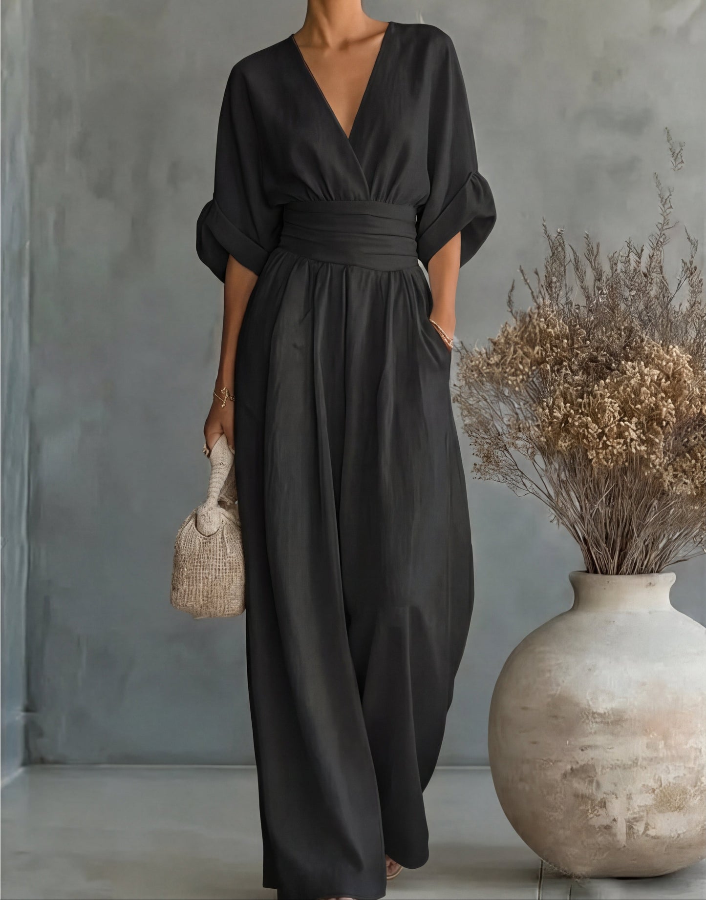 Gina Women’s Jumpsuit featuring a stylish wrap bodice and elegant wide-leg design, perfect for casual outings or special occasions. 10