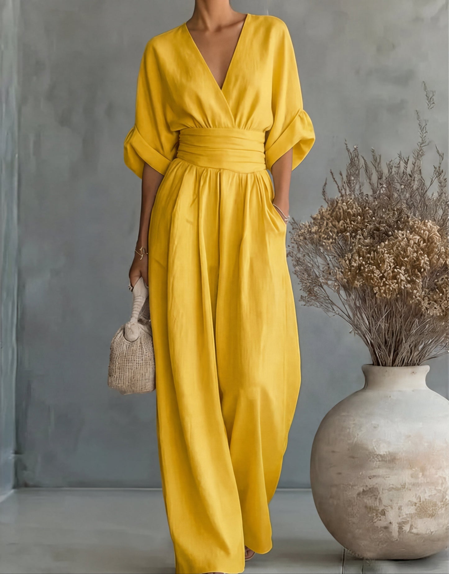 Gina Women’s Jumpsuit featuring a stylish wrap bodice and elegant wide-leg design, perfect for casual outings or special occasions. 13