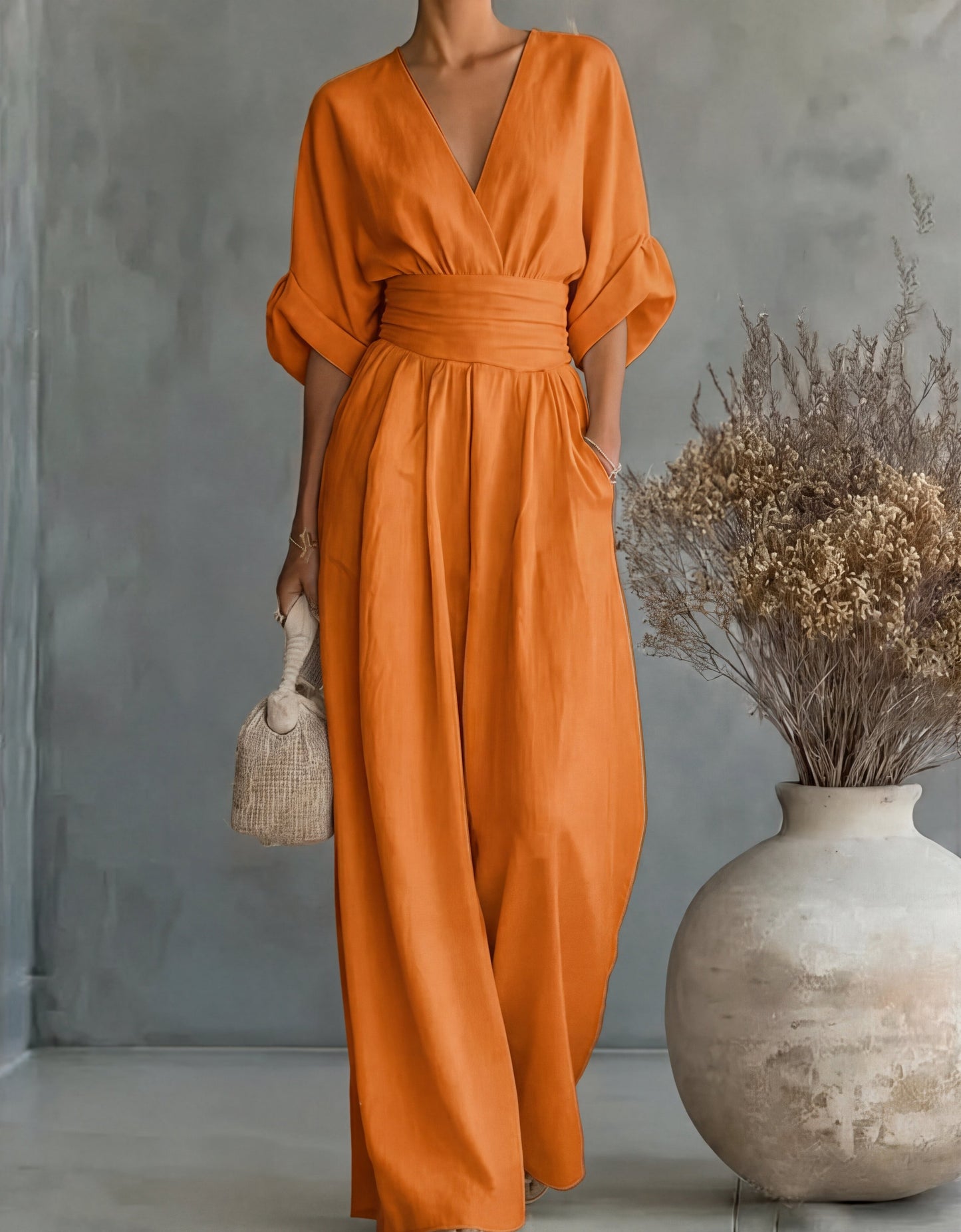 Gina Women’s Jumpsuit featuring a stylish wrap bodice and elegant wide-leg design, perfect for casual outings or special occasions. 14