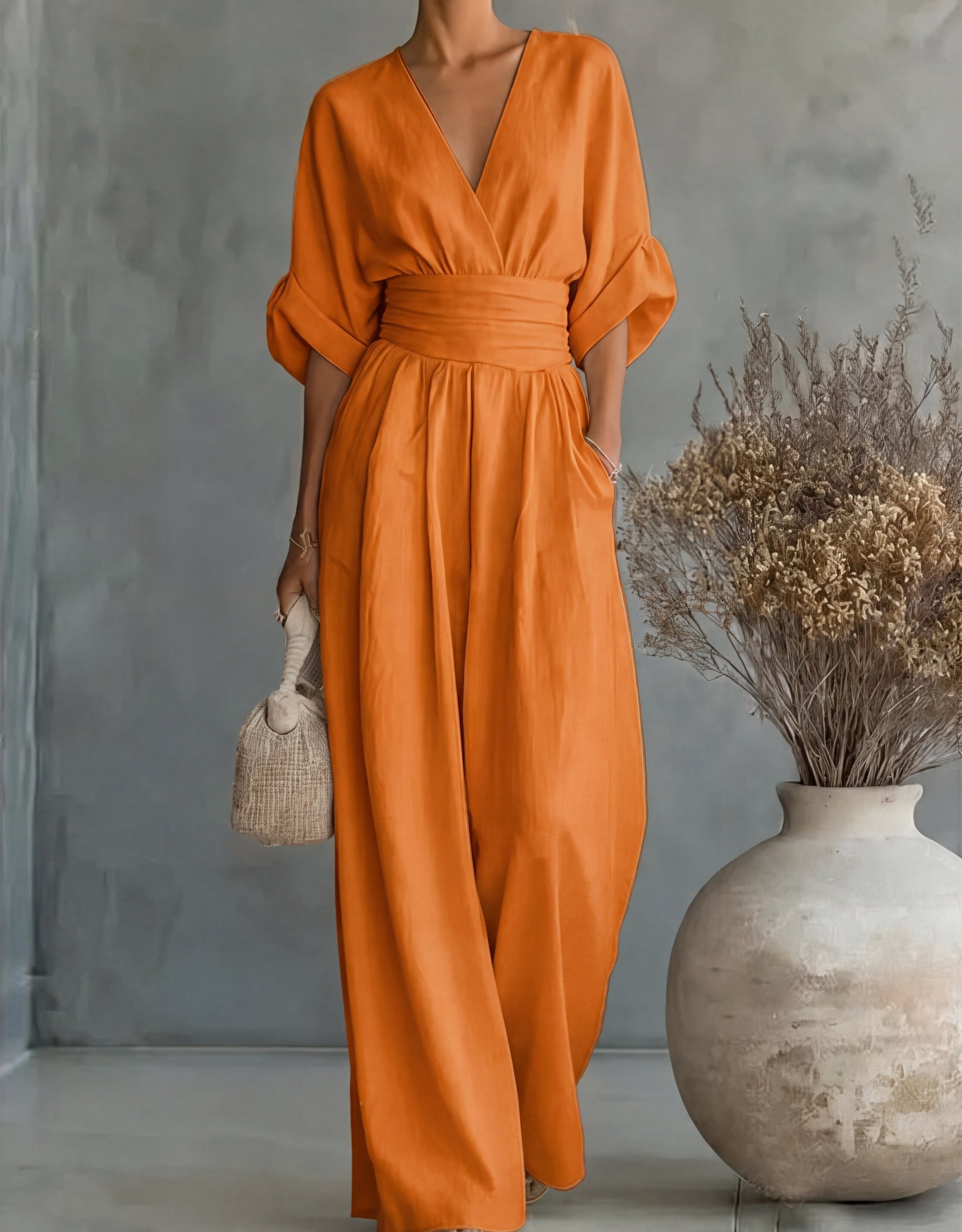 Gina Women’s Jumpsuit featuring a stylish wrap bodice and elegant wide-leg design, perfect for casual outings or special occasions. 14