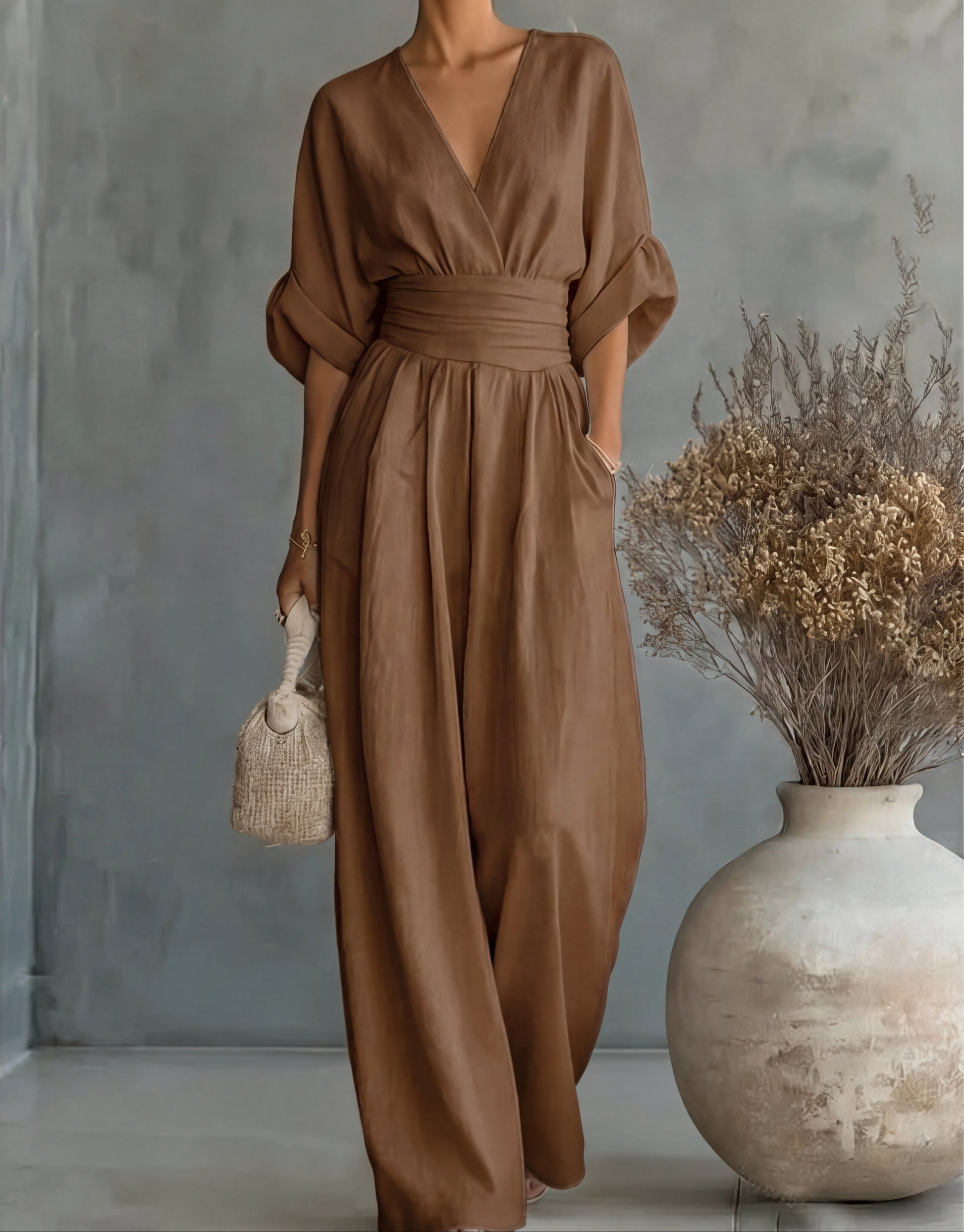 Gina Women’s Jumpsuit featuring a stylish wrap bodice and elegant wide-leg design, perfect for casual outings or special occasions. 9