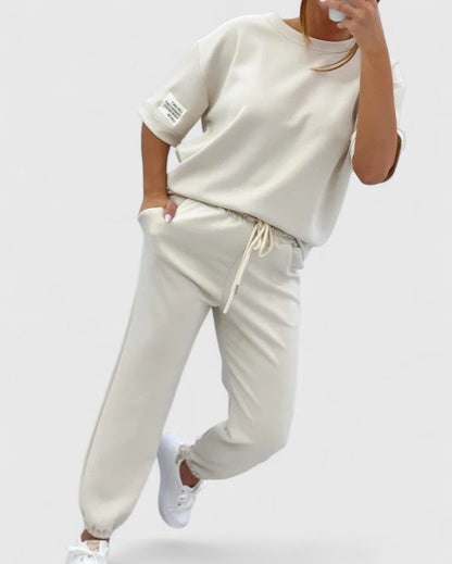 Glory Women’s Comfortable Set featuring a stylish half-moon sleeve top and adjustable ankle-length trousers, perfect for casual outings and relaxed days at home. 2