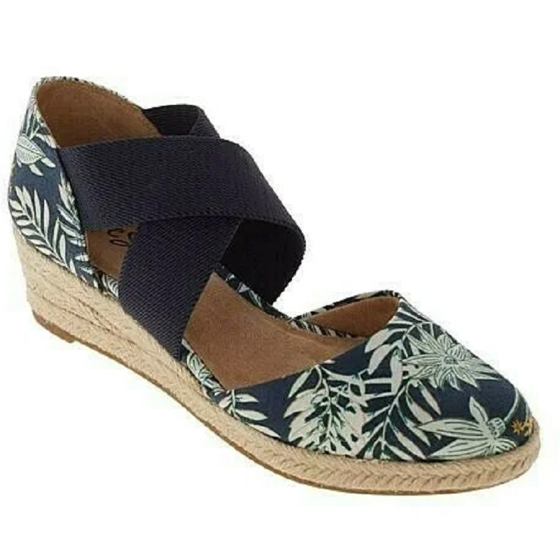 Grace Women’s Orthopedic Flat Shoes featuring non-slip soles and stylish crossed straps, designed for comfort and support. 1