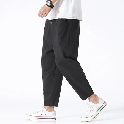 Grove Men’s Cropped Pants featuring an adjustable drawstring waist and articulated paneling for enhanced comfort and style. 1