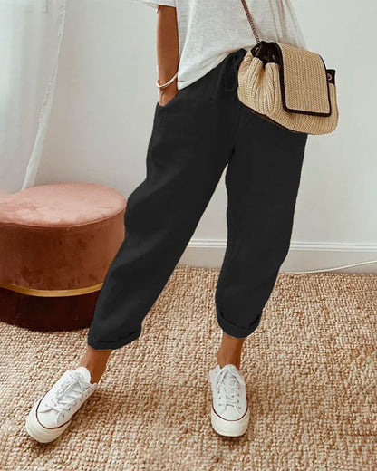 Helga Women's Trousers featuring a flattering fit and breathable design, perfect for comfort and style in any casual or professional setting. 1