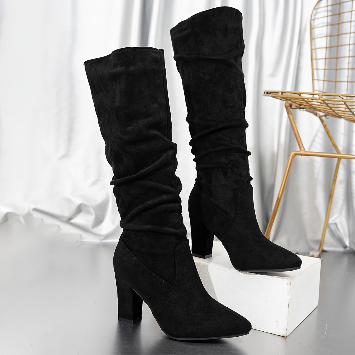 Isolde Women's knee-high boots featuring a stylish slouchy design and comfortable block heel, perfect for fashionable and versatile wear. 0