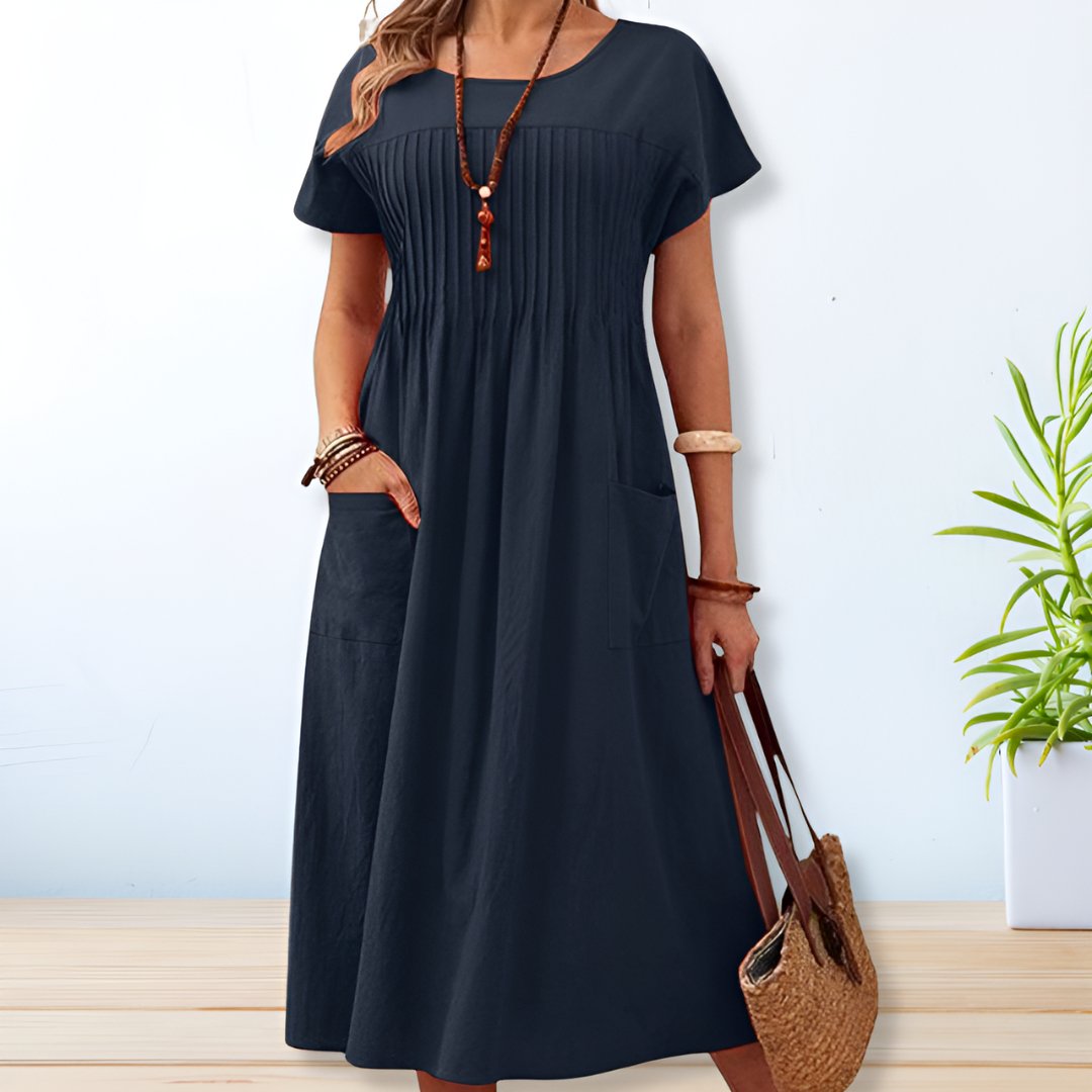 Jade women's summer dress featuring a relaxed fit and convenient side pockets, perfect for comfortable and stylish warm-weather wear. 0