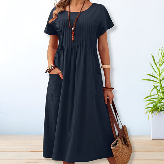 Jade women's summer dress featuring a relaxed fit and convenient side pockets, perfect for comfortable and stylish warm-weather wear. 0