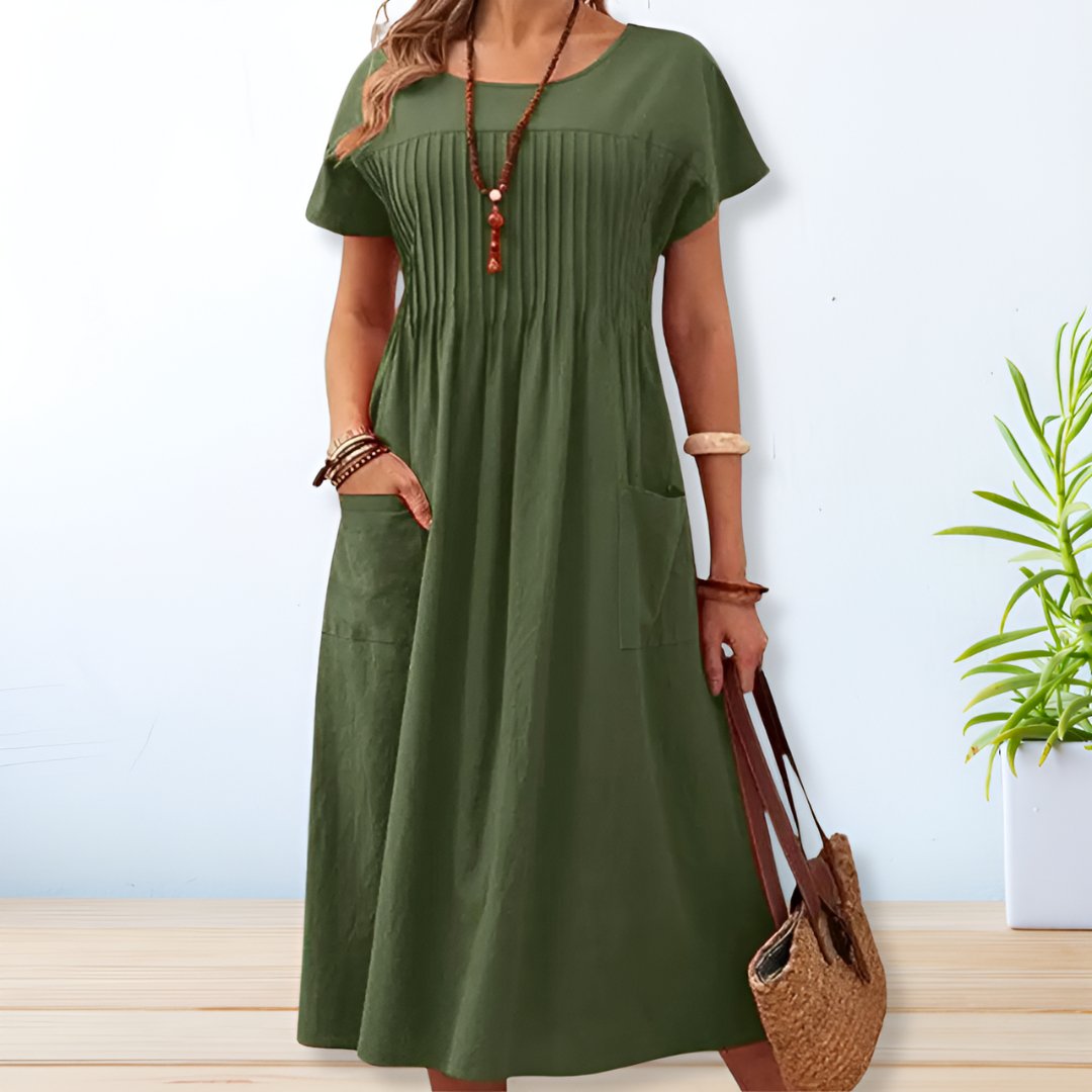 Jade women's summer dress featuring a relaxed fit and convenient side pockets, perfect for comfortable and stylish warm-weather wear. 1