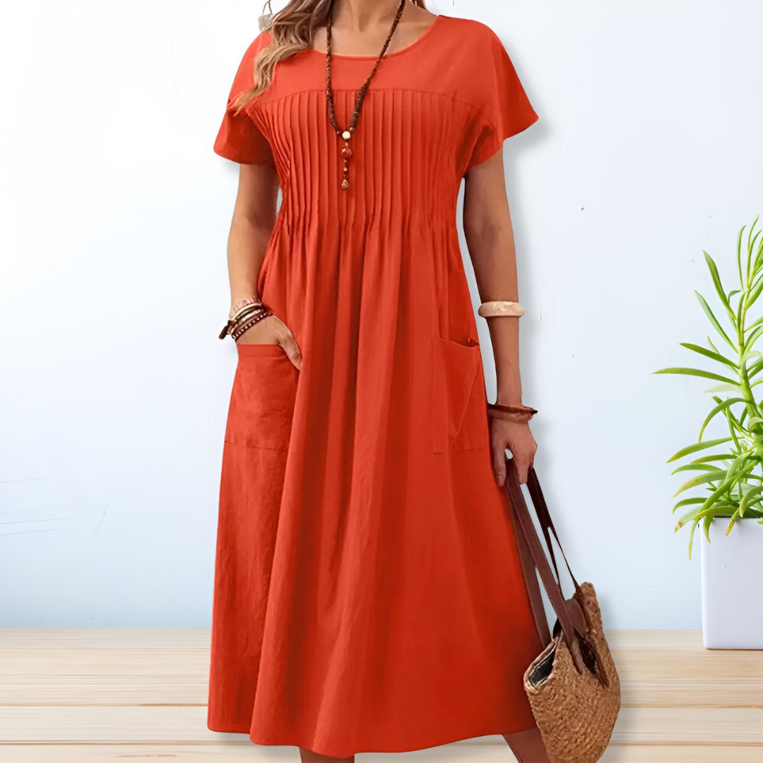 Jade women's summer dress featuring a relaxed fit and convenient side pockets, perfect for comfortable and stylish warm-weather wear. 2