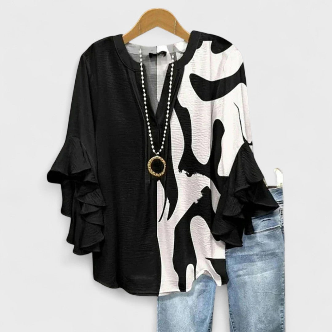 Kara Women’s Blouse featuring a lightweight and airy design, perfect for summer wear, showcasing a stylish and comfortable fit ideal for warm weather outings. 4