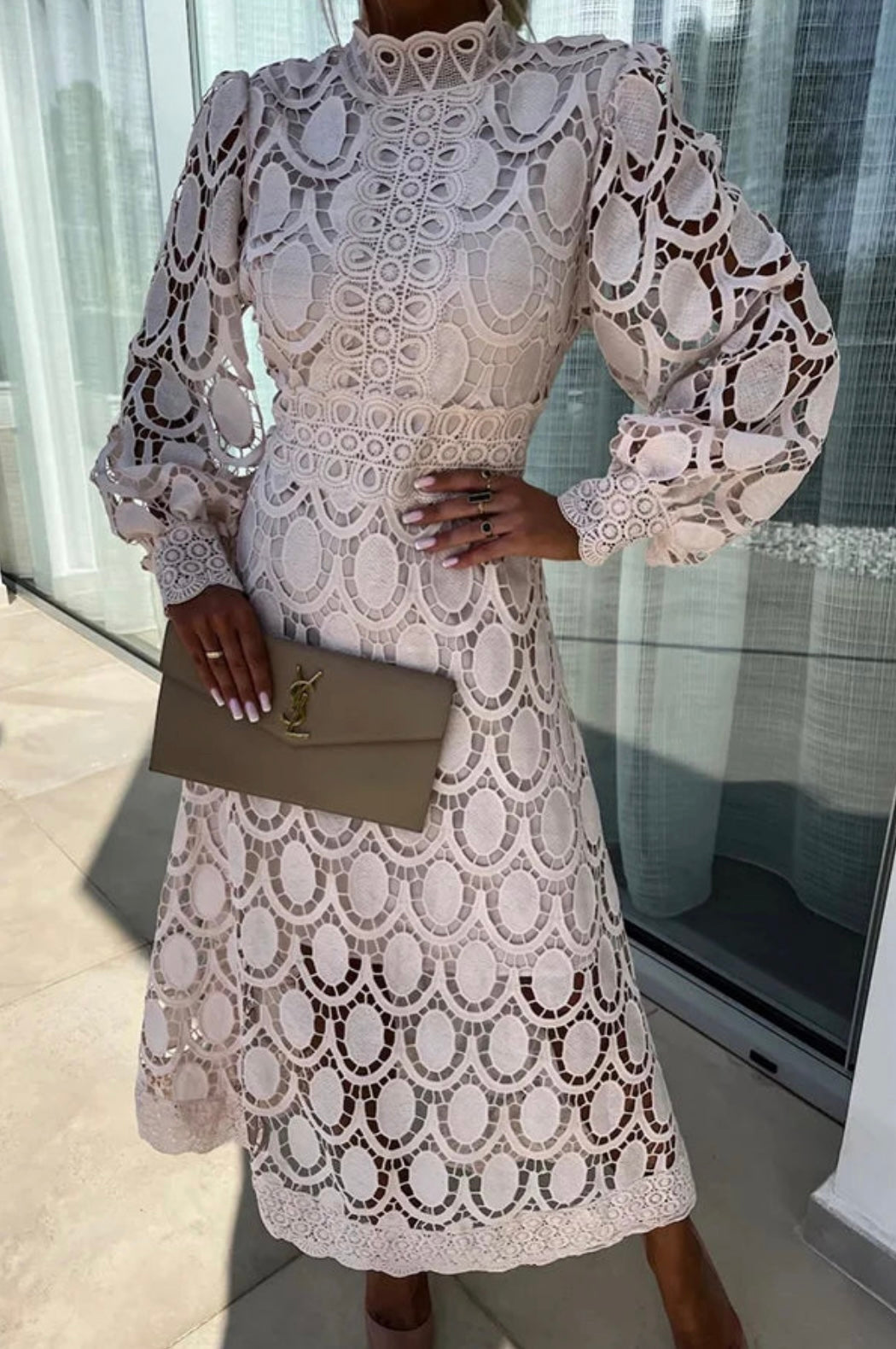 Luxe women’s dress featuring intricate lace detailing and a flattering midi length, perfect for elegant occasions and stylish outings. 1