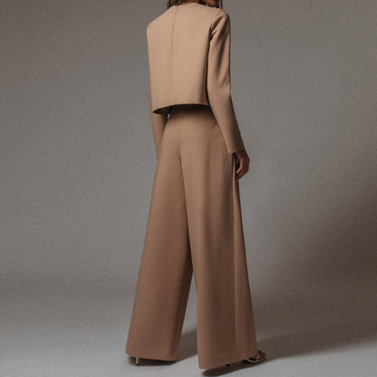 Luxe women’s two-piece outfit featuring a stylish cropped top and elegant wide-leg trousers, perfect for fashionable casual or semi-formal occasions. 8