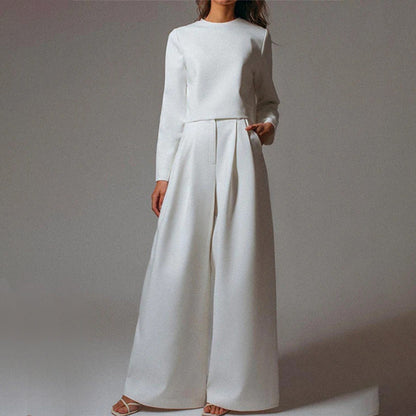 Luxe women’s two-piece outfit featuring a stylish cropped top and elegant wide-leg trousers, perfect for fashionable casual or semi-formal occasions. 9