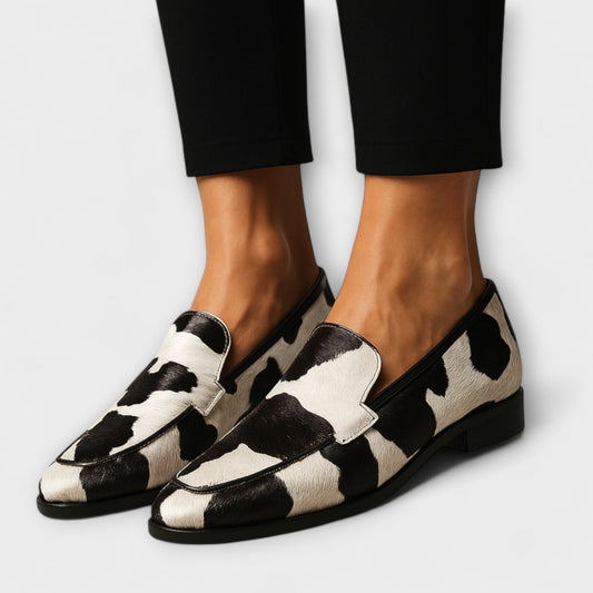 Margo Women’s Modern Loafer featuring a stylish cow pattern and elegant pointed toe design, perfect for chic and comfortable everyday wear. 0