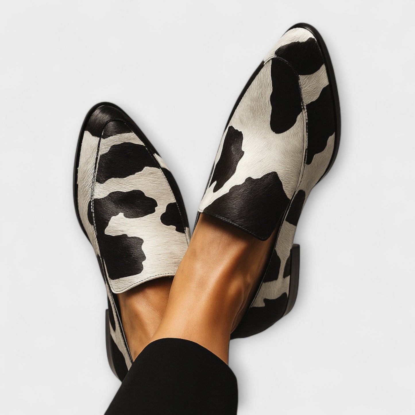 Margo Women’s Modern Loafer featuring a stylish cow pattern and elegant pointed toe design, perfect for chic and comfortable everyday wear. 1