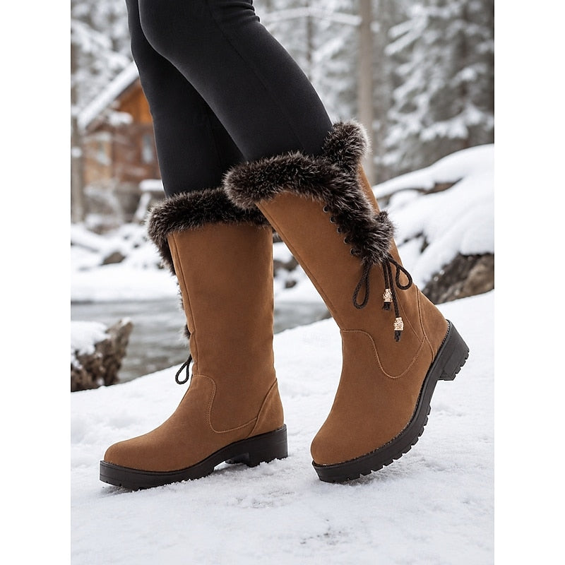 Meredith Women's Knee-High Winter Boots featuring a stylish fur trim, designed for warmth and comfort in cold weather. 2
