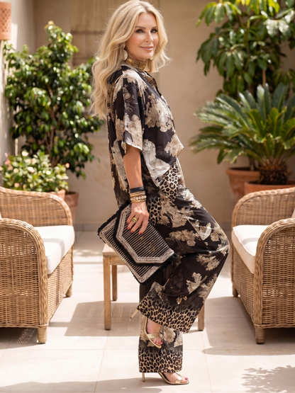 Mina Women’s Two Piece Set featuring a stylish wrap top and wide leg trousers, perfect for casual outings or summer events, showcasing a modern and chic 1