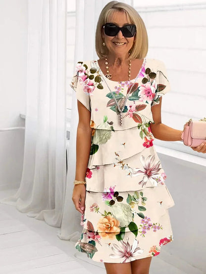 Mira Women’s Dress featuring a ruffled floral design and elegant pleated detail, perfect for spring and summer occasions. 3
