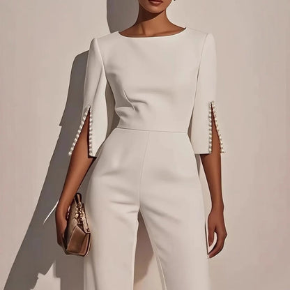 Mira Women's jumpsuit featuring elegant pearl-embellished sleeves and a stylish wide-leg silhouette, perfect for chic occasions. 0