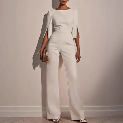 Mira Women's jumpsuit featuring elegant pearl-embellished sleeves and a stylish wide-leg silhouette, perfect for chic occasions. 1