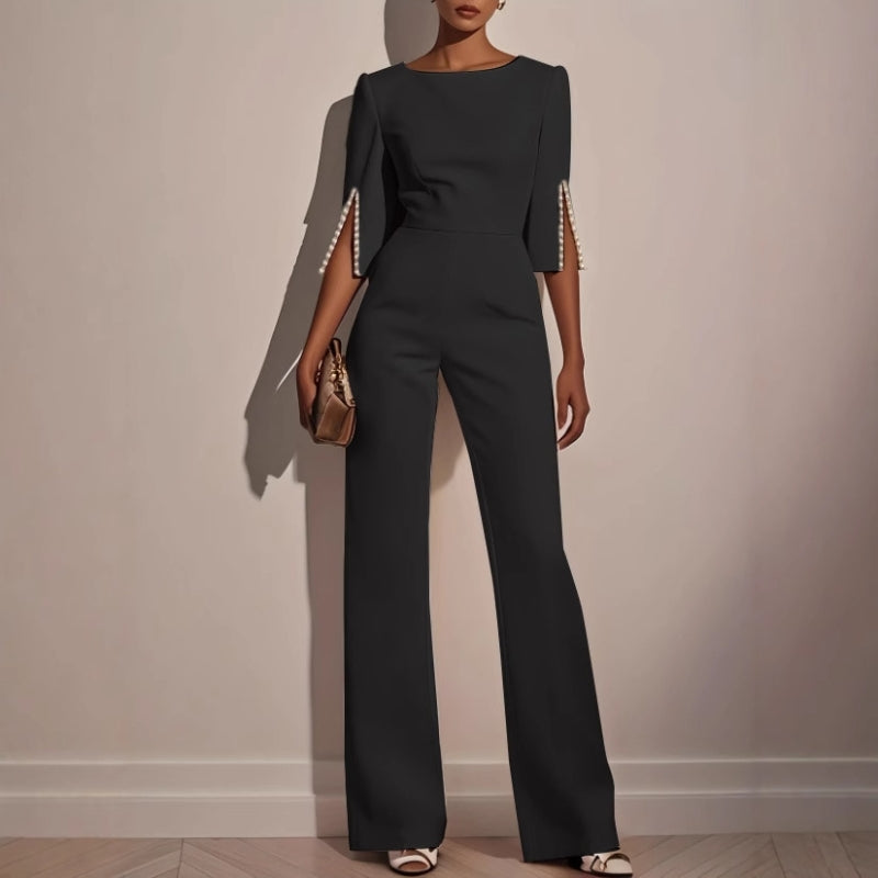 Mira Women's jumpsuit featuring elegant pearl-embellished sleeves and a stylish wide-leg silhouette, perfect for chic occasions. 2