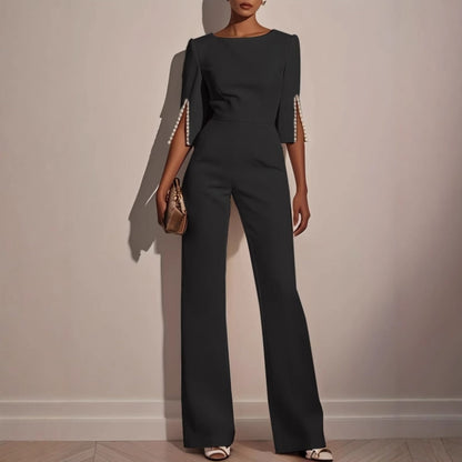 Mira Women's jumpsuit featuring elegant pearl-embellished sleeves and a stylish wide-leg silhouette, perfect for chic occasions. 2