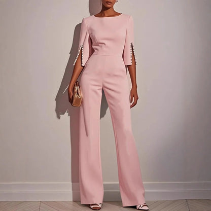 Mira Women's jumpsuit featuring elegant pearl-embellished sleeves and a stylish wide-leg silhouette, perfect for chic occasions. 4