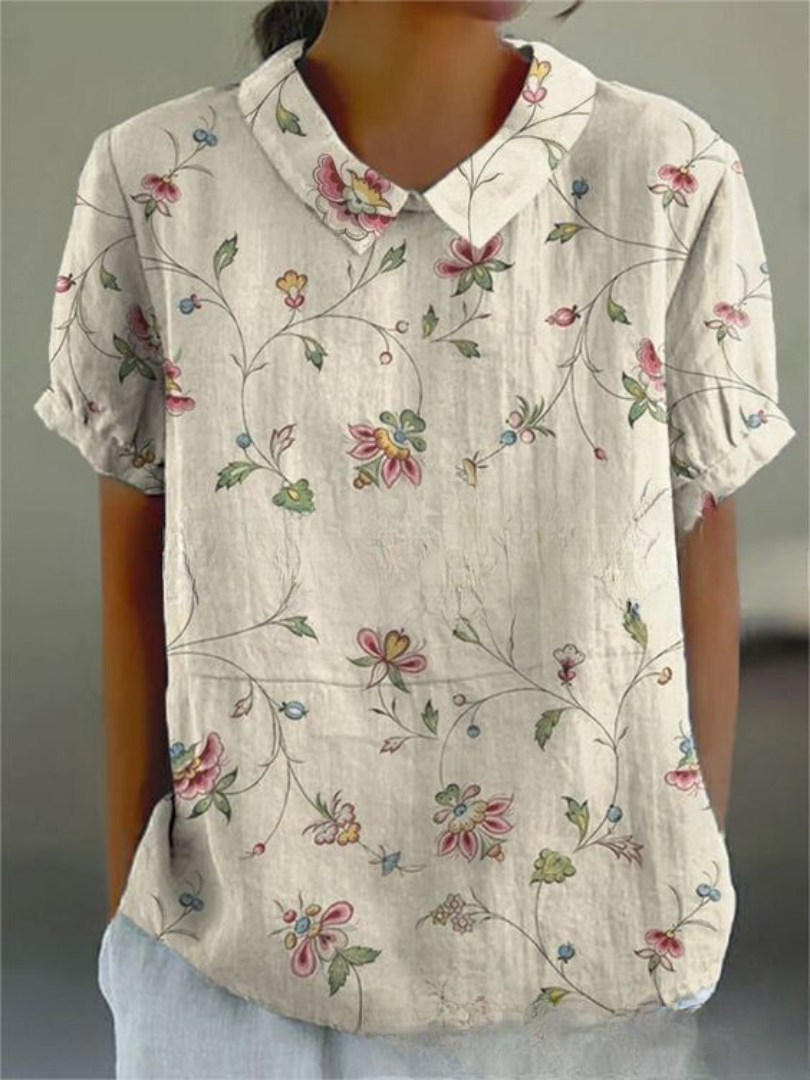 Nova Women's Shirt featuring a relaxed fit and vibrant floral design, perfect for casual outings and spring fashion. 1