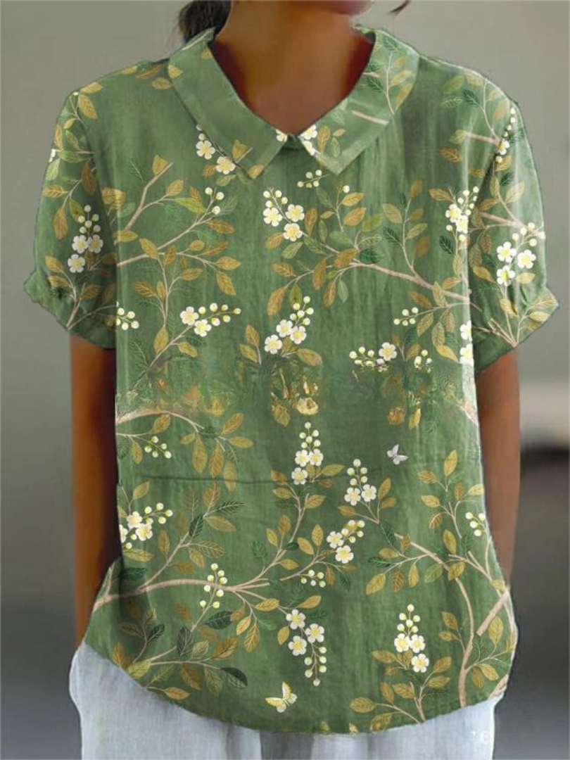 Nova Women's Shirt featuring a relaxed fit and vibrant floral design, perfect for casual outings and spring fashion. 2