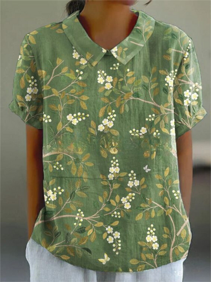 Nova Women's Shirt featuring a relaxed fit and vibrant floral design, perfect for casual outings and spring fashion. 2