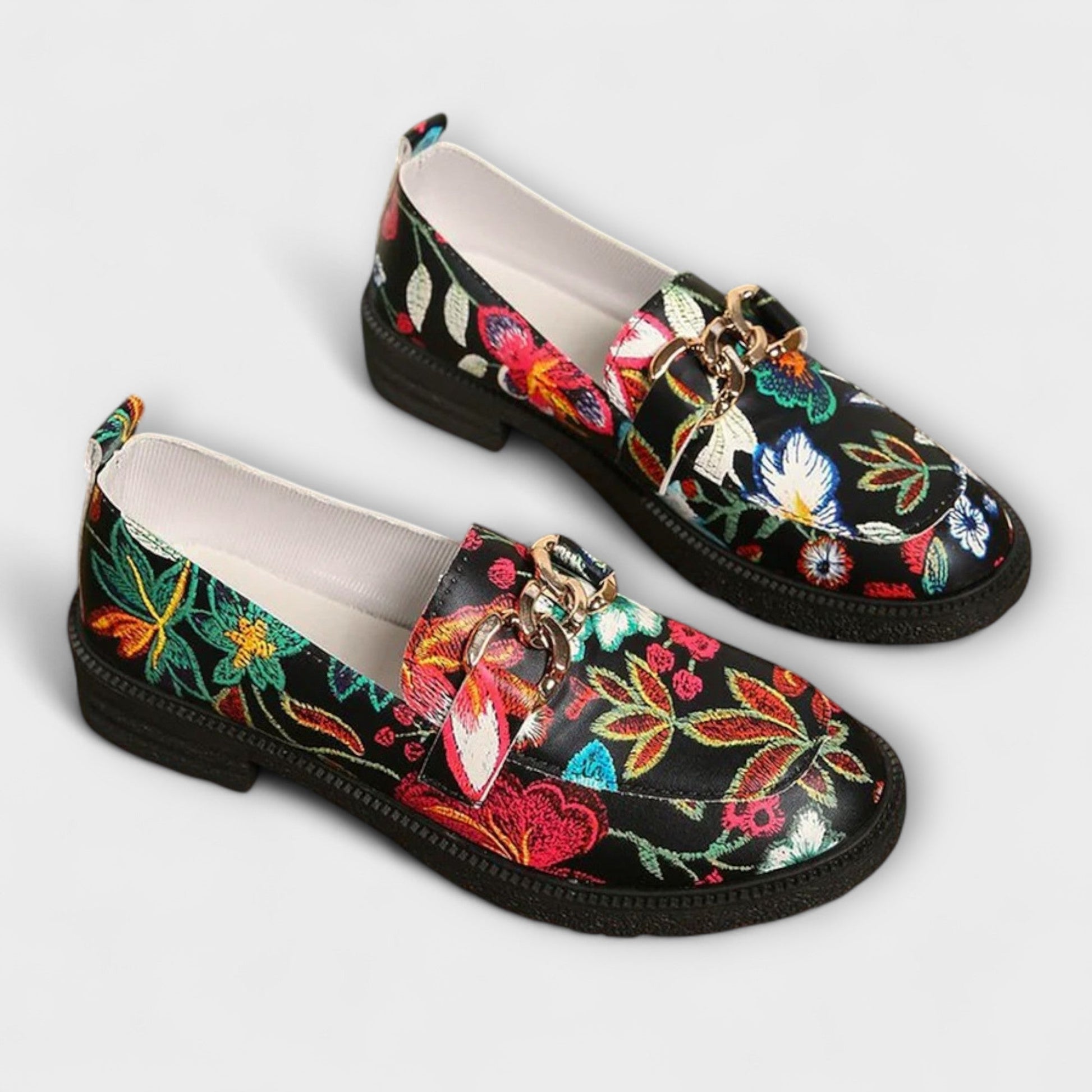 Orlia Women’s Loafers featuring a vibrant multicoloured floral print and a convenient slip-on design, perfect for casual wear. 0