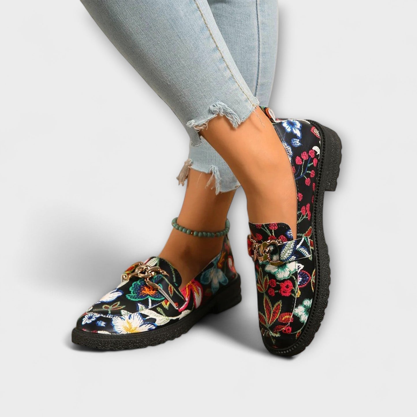 Orlia Women’s Loafers featuring a vibrant multicoloured floral print and a convenient slip-on design, perfect for casual wear. 1